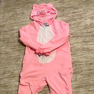 A pink pig onesie